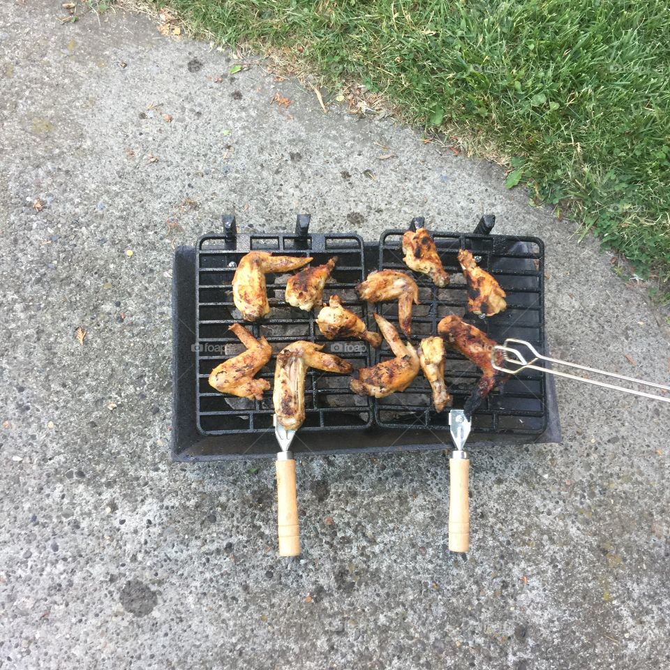Grillin wings old school over charcoal the way to go 