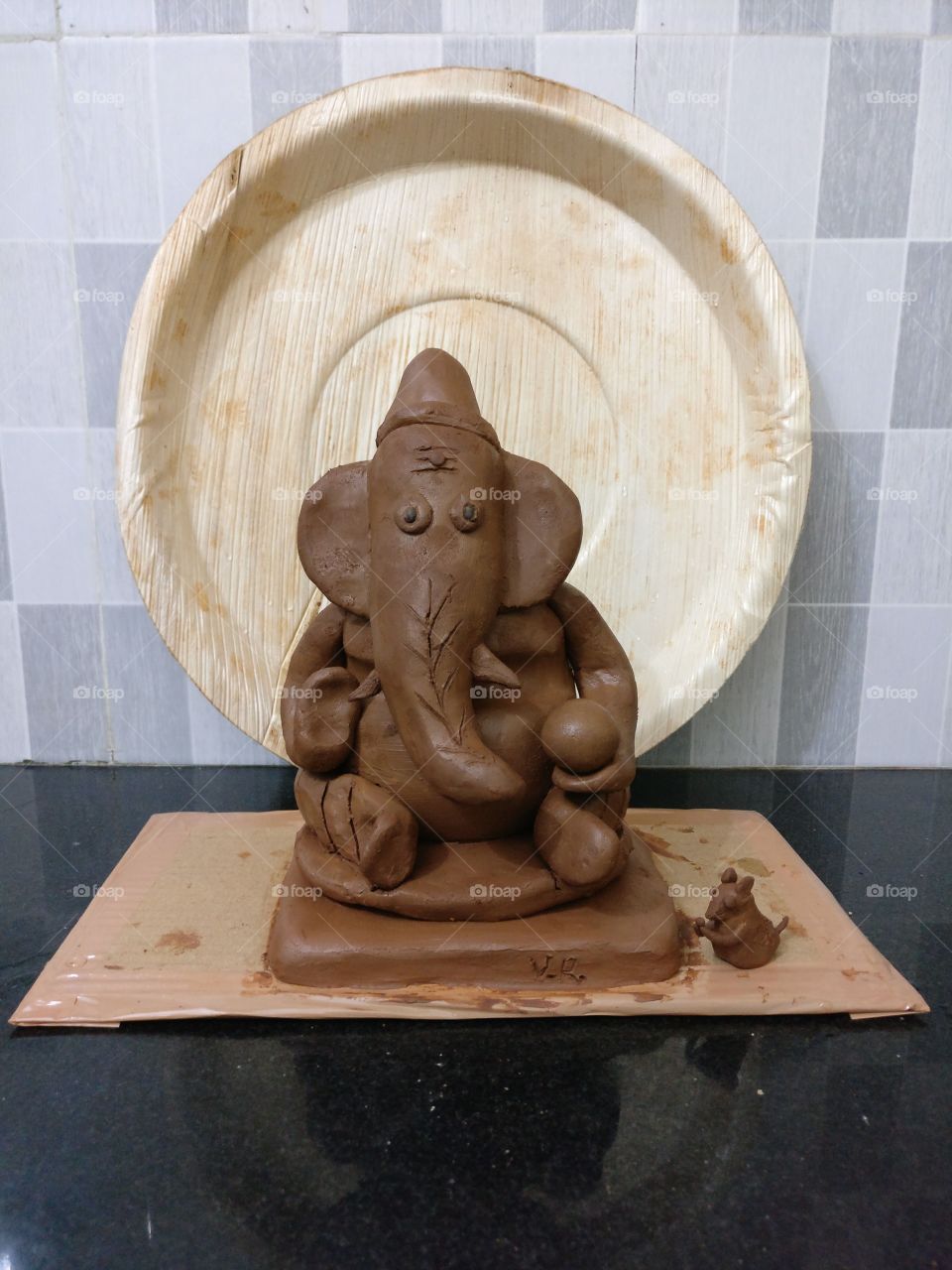 Ganesha idol.. made by me.. Laddu on hand and mouse by his side