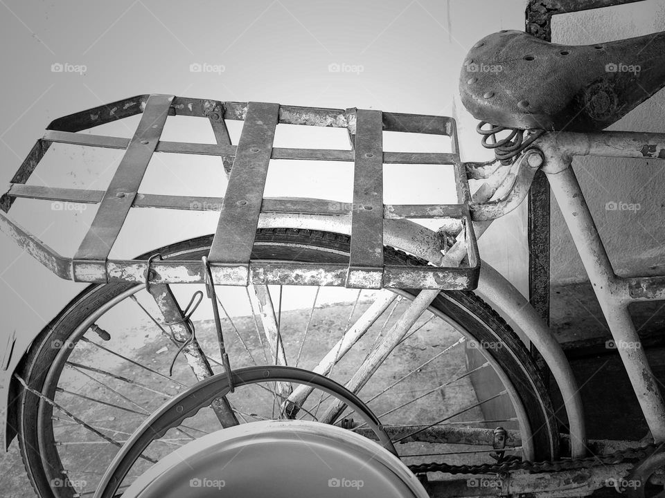 Close view of an old hawker bicycle in back and white.