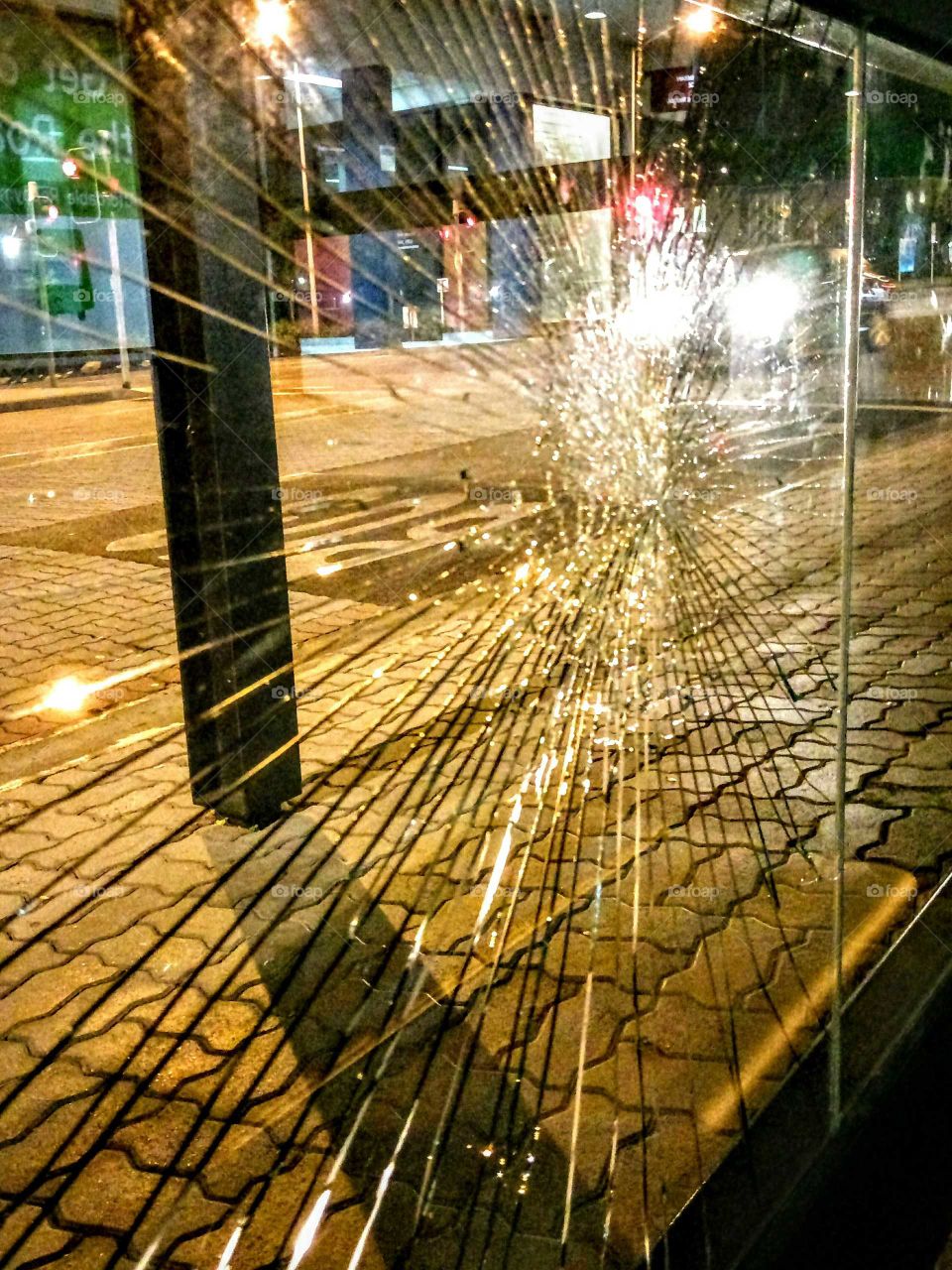car headlights  shot through shattered glass !