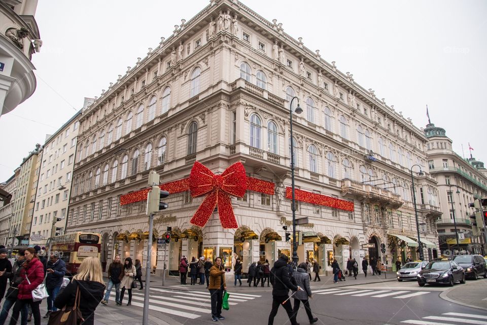 Red Christmas bow on a shopping building in Vienna