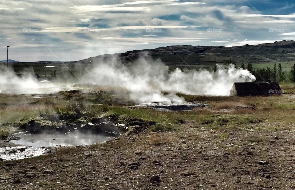 Hot springs on Iceland. Steam from holes in the ground. 