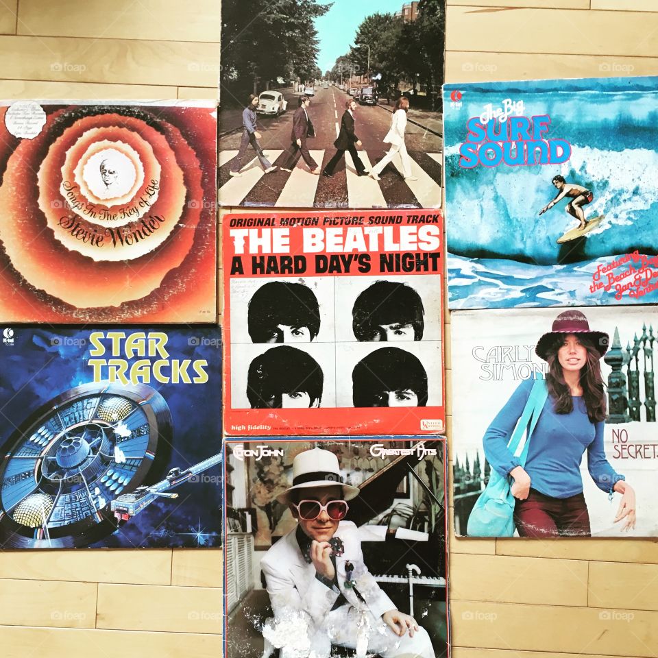 Vinyl record collection. flat lay of The Beatles, Elton John, Carly Simon, Stevie Wonder and other classic compilations.
