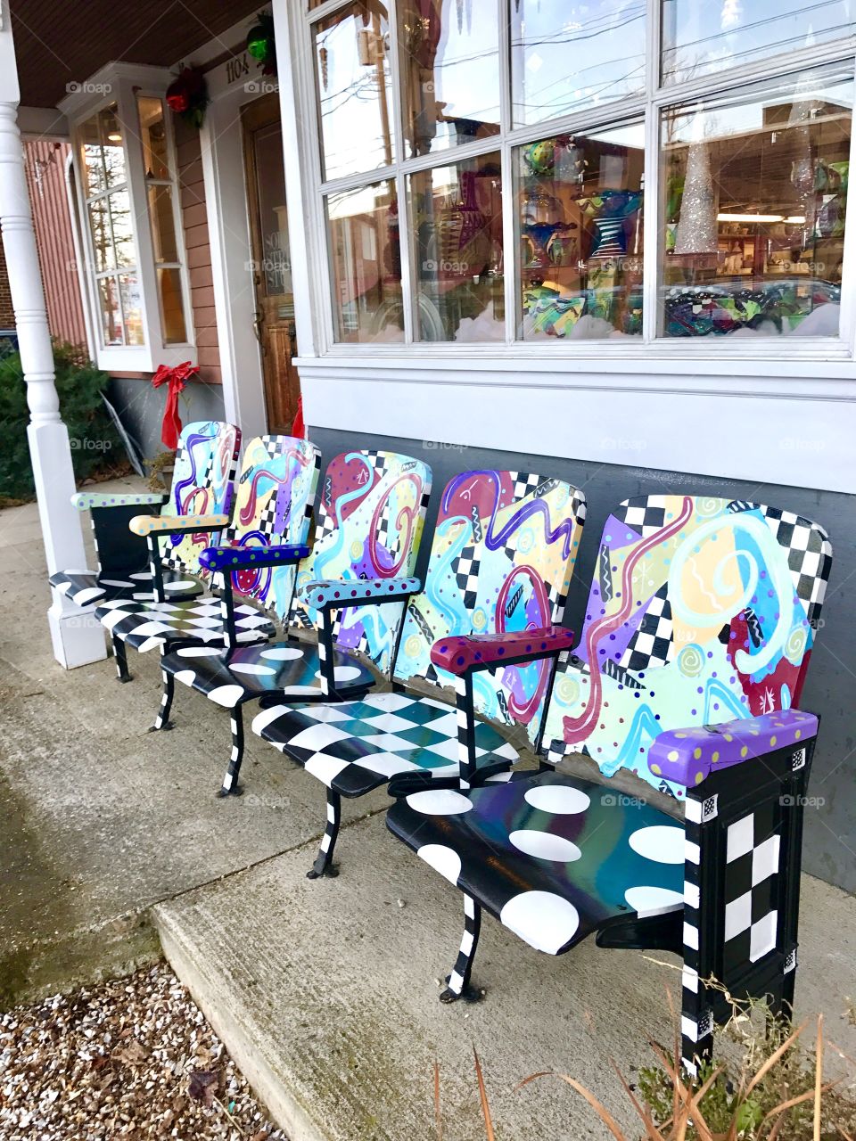 Row of whimsically painted chairs