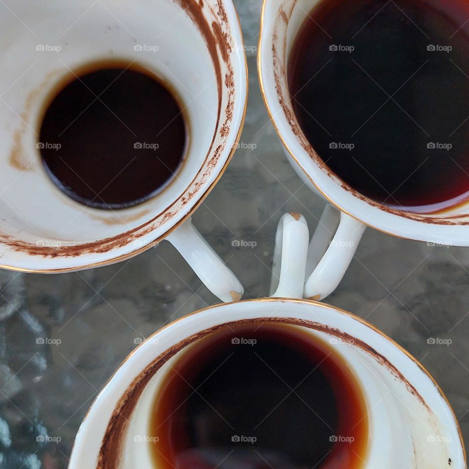 coffee in a partially drunk cup with traces of coffee on the edge of the cup