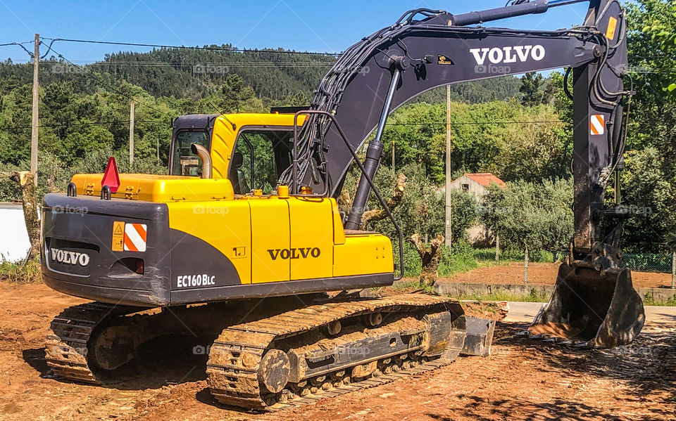 Volvo hydraulic excavator, seen with a countryside setting