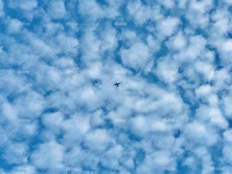 A blue sky and silver colour clouds in between an aeroplane. Looks amazing 🤩