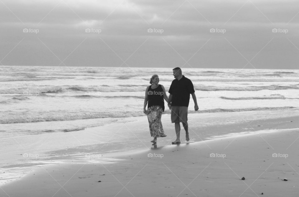 Couple holding hand at beach