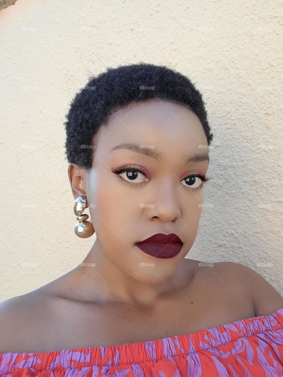 Black Woman with short natural hair.