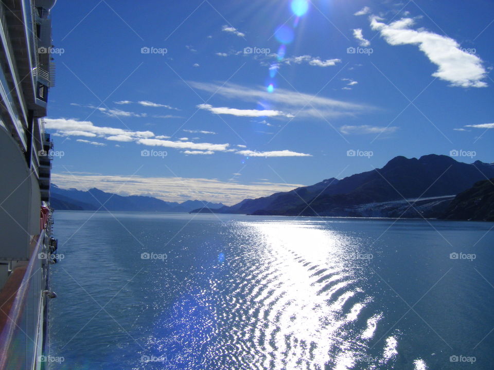 Bright sunny day view from Balcony on cruise ship through inside passage to Alaska