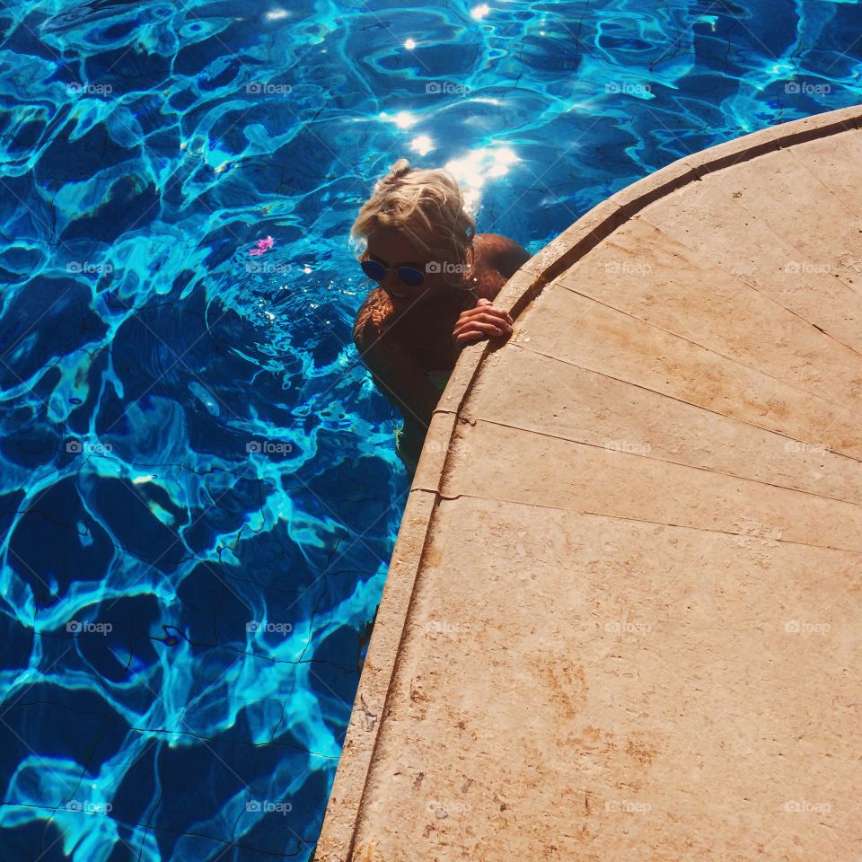 Woman enjoying in swimming pool