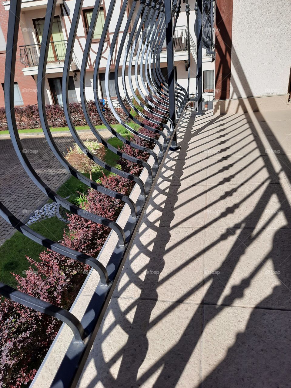 shadow of the balcony railing