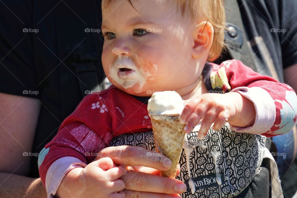 Baby Girl Eating A Messy Ice Cream Cone