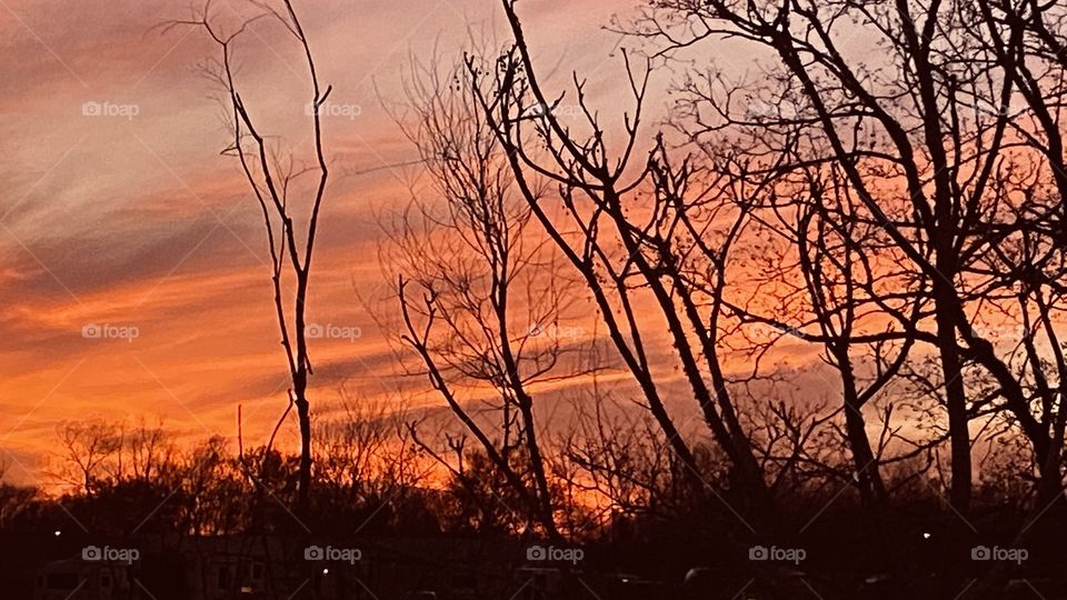 Trailing was this fire engulfed with multiple rays feathering across the Evening Sky. 