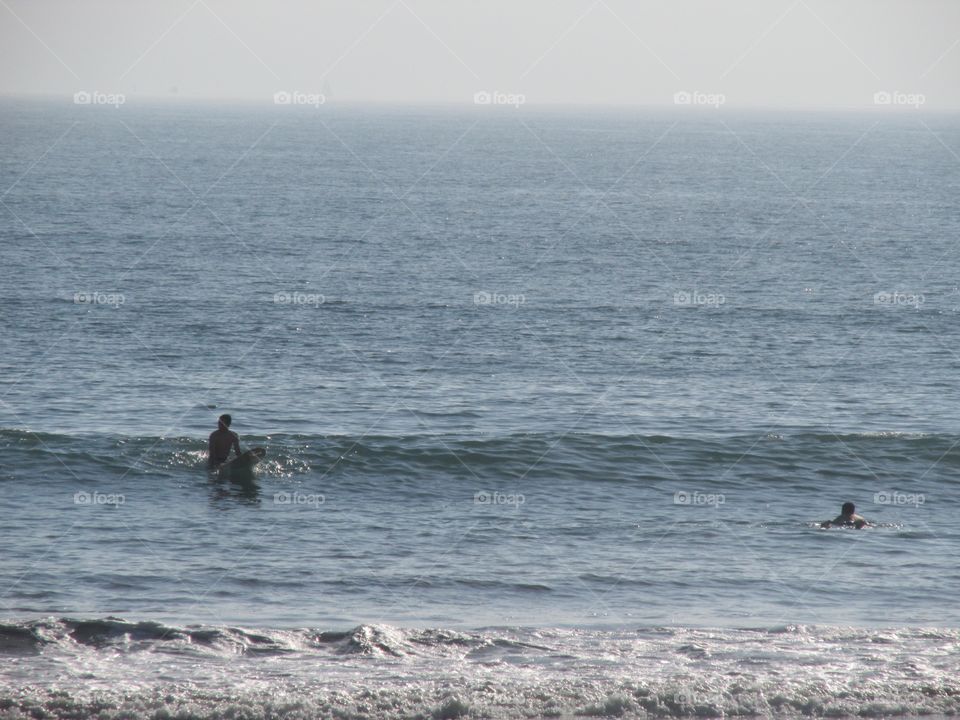 surfers ready for a wave