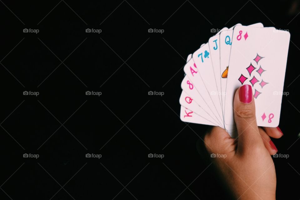 Women playing card in casino 