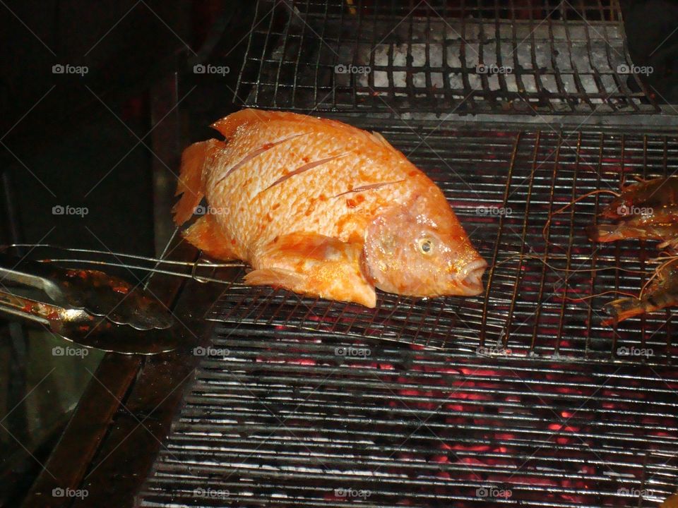 Grilled Fish. Fish being freshly prepared at Ban Thanh food market, Ho Chi Minh, Vietnam