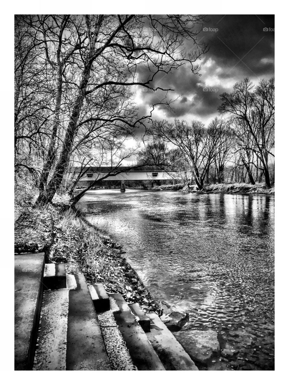 Black and white view of the covered bridge 

