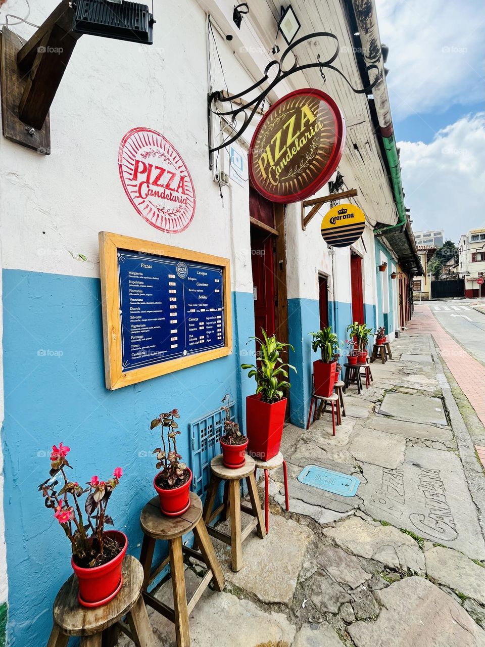 Wood chairs in a colorful street 