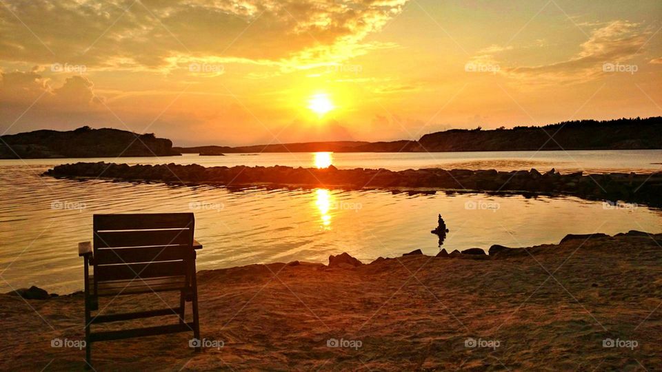 Empty chair near the sea