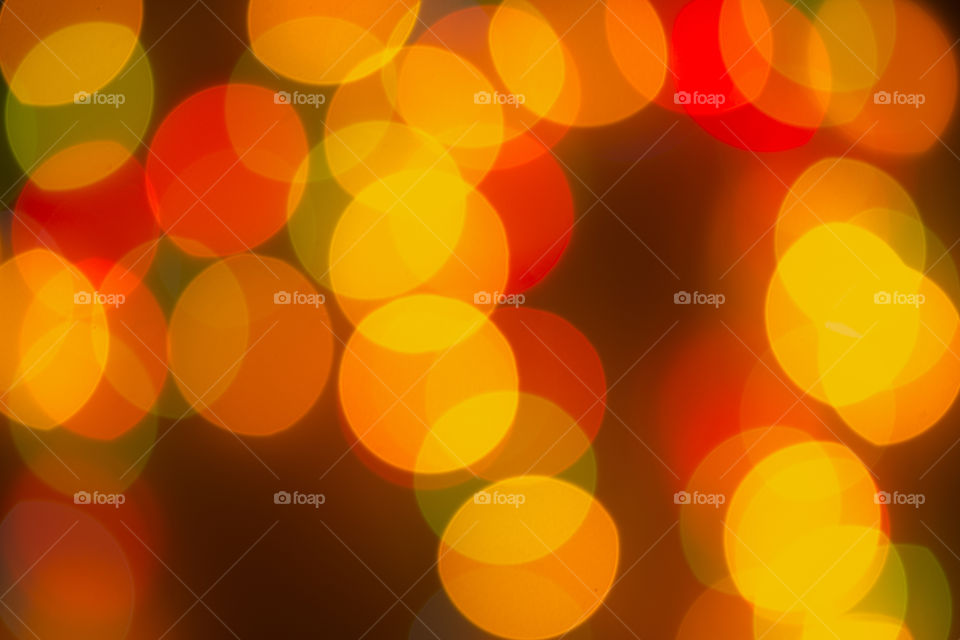 Blurring background for a holiday greeting card, banner advertising. Shimmering bokeh, lights of the city.