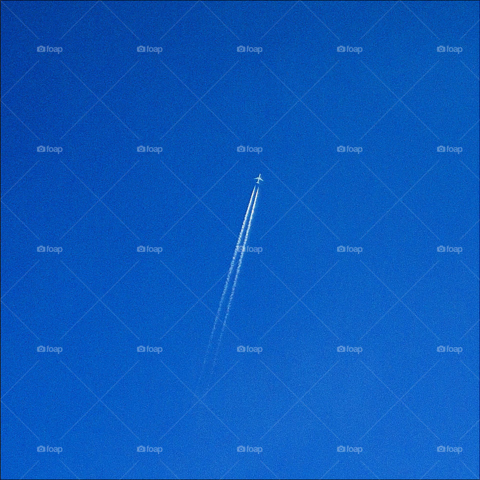 Airliner jet in blue skies