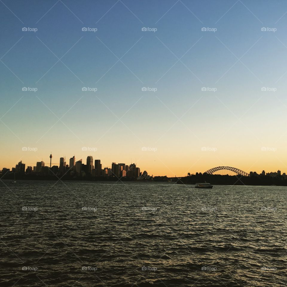 Sydney harbour bridge sunset over Sydney opera house view from toronga zoo harbour Sydney