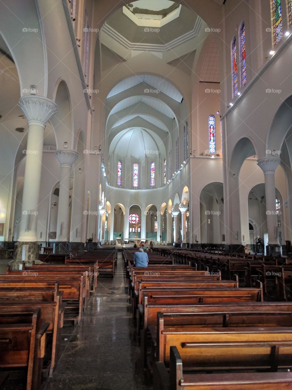 Arches and columns, stained glass in a magnificent cathedral