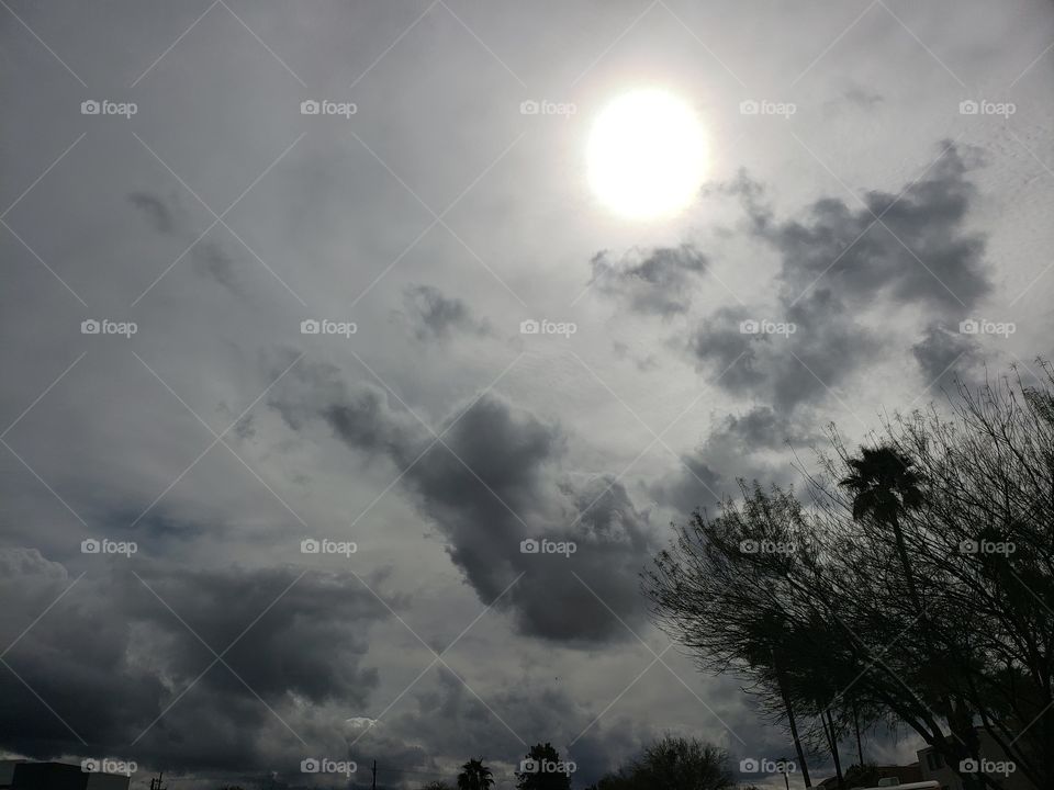 sun shining through the clouds