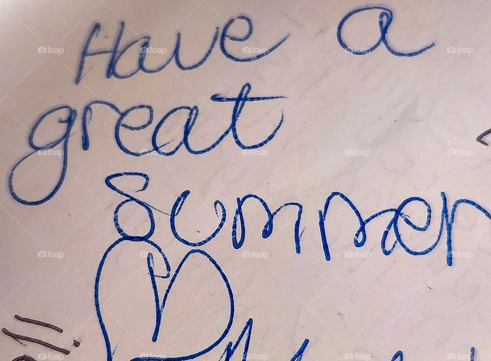 a classic school yearbook signature phrase handwritten in blue pen with a heart: Have a Great Summer!