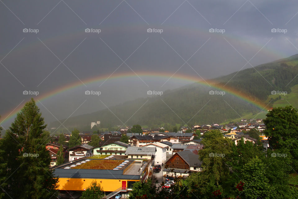 Double rainbow over small village 