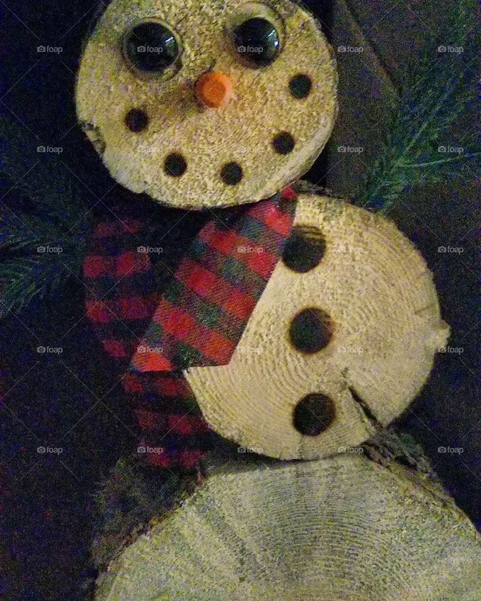 He we have a snowman made out of wood. We can create our own art with something from our mind. Happy Christmas to you all.