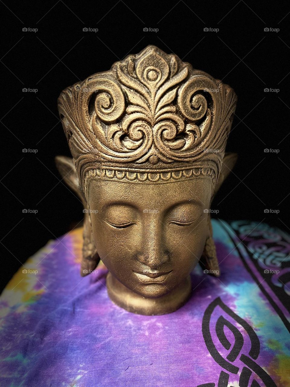 A Golden Buddha Meditating in the dark.