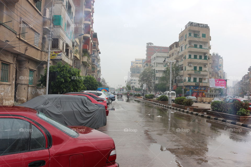 City Street - Cars - Raining - Buildings - Sky - Nature - Egypt