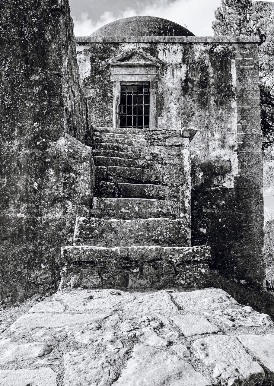 Stone steps leading up to a domed tower that forms part of Acueducto de los Pegões, Tomar in Portugal 