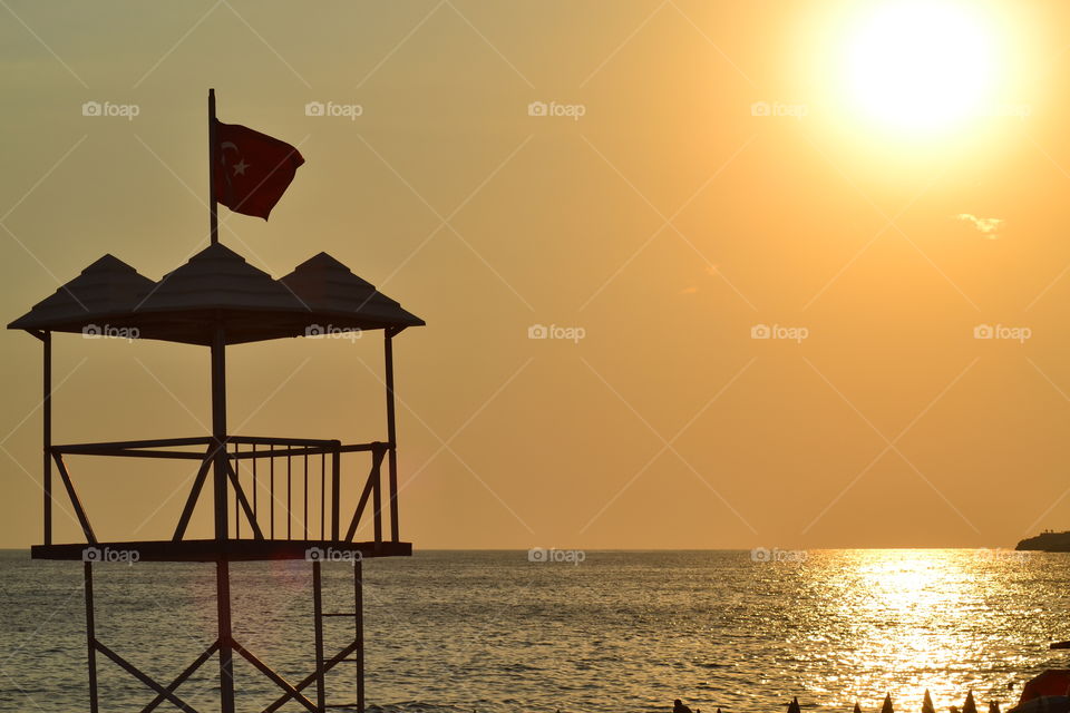 lifeguard tower in sunset