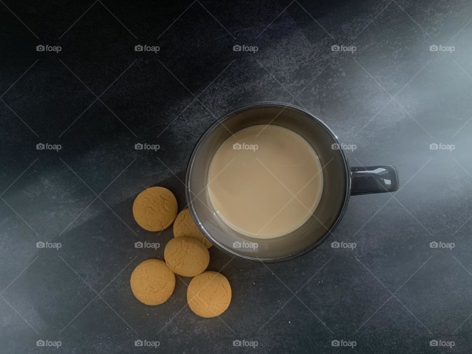 A cup of milk and cookies flat lay