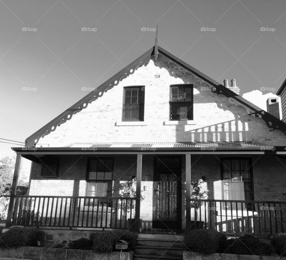 Victoria style house with simple verandah and chimney 