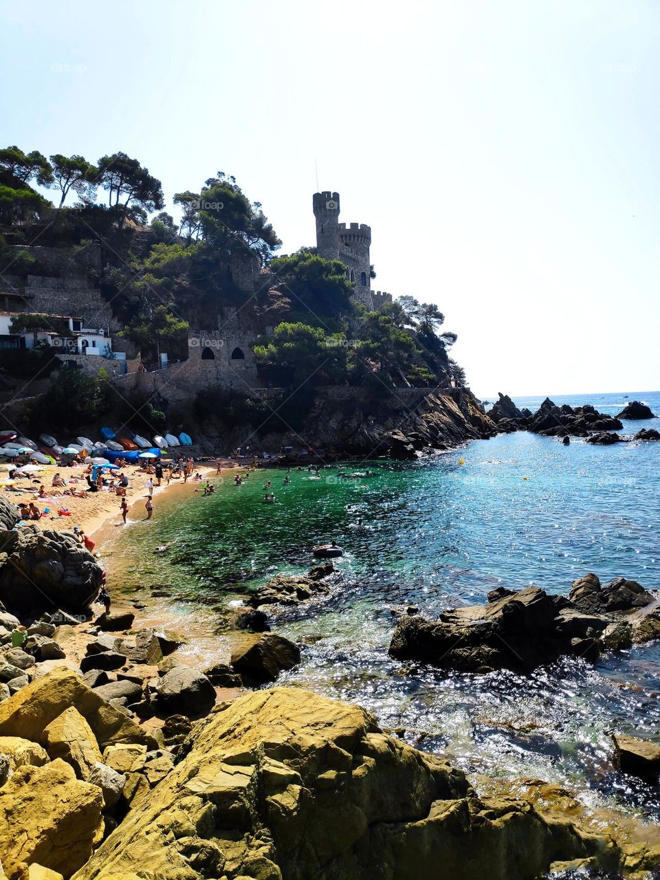 The castle watches over the beach.