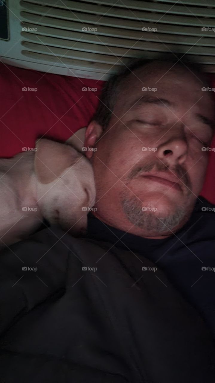 My sweet fur baby (aka,bear) sleeping with Daddy. Sleepy little boy.