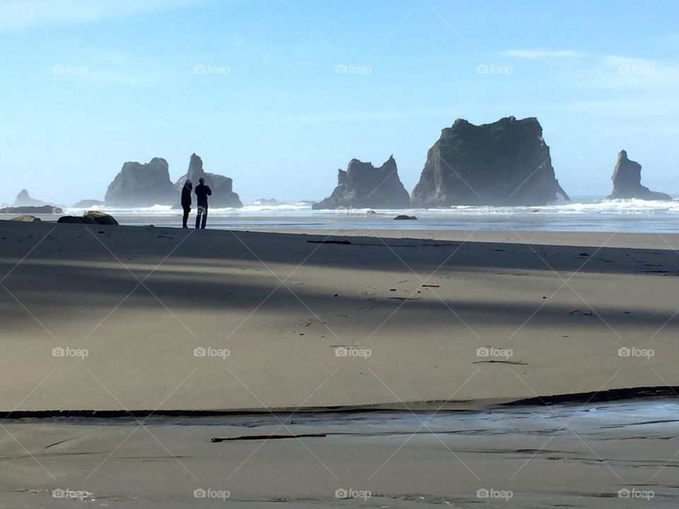 Couple On Beach. Silhouette of couple on beach