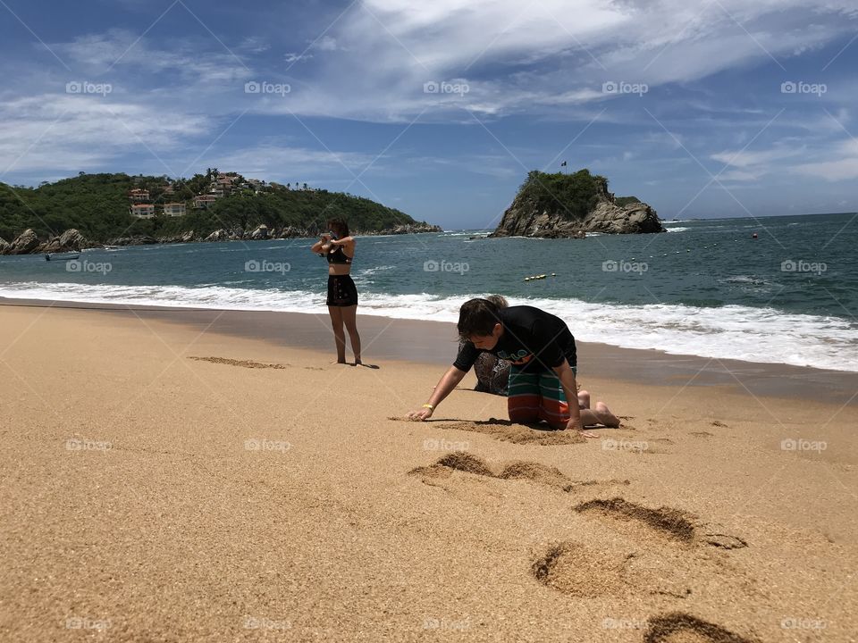 Beach scene kids sand castle play