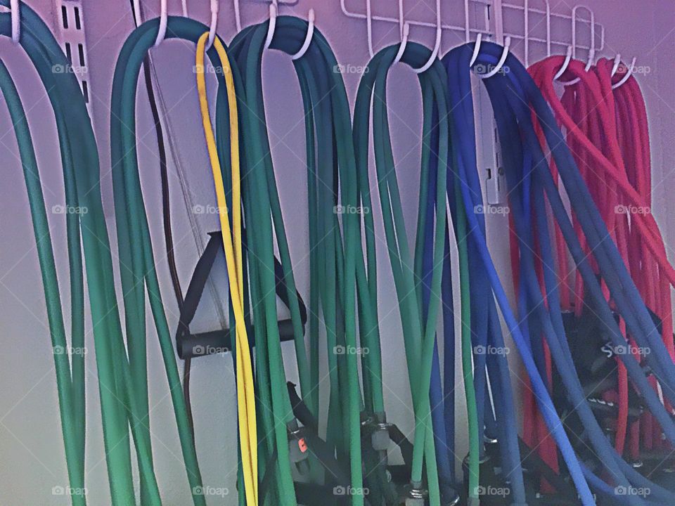 Row of exercise bands at the gym.