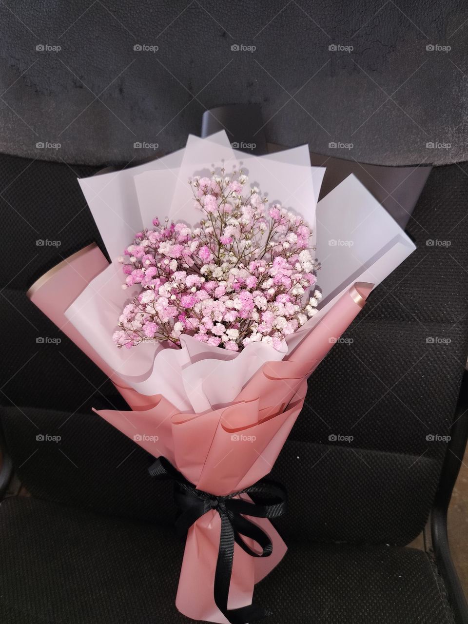 Beautiful pink and white baby breath flower bouquet close shot