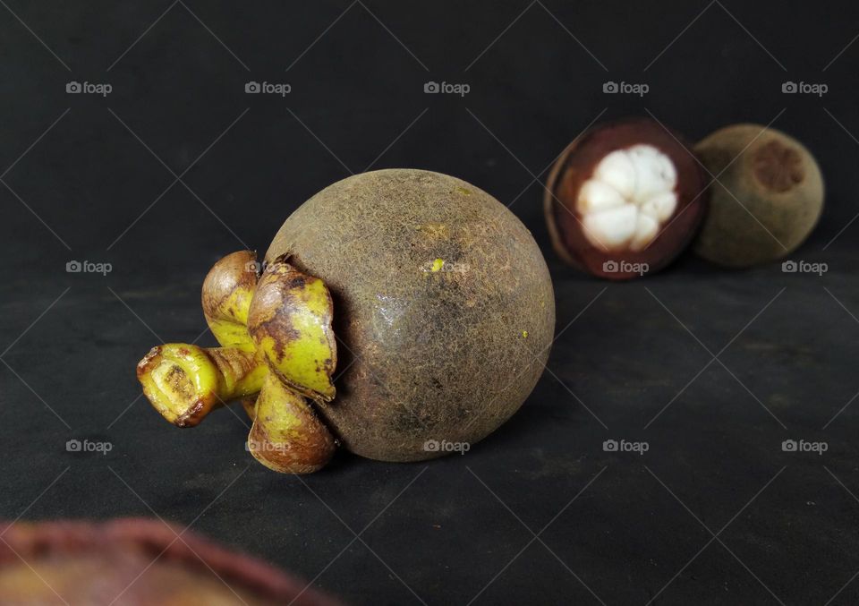 closeup of an exotic fruit,  mangosteen