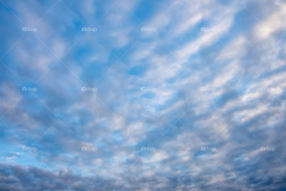 The beauty of the sky with clouds and the sun.