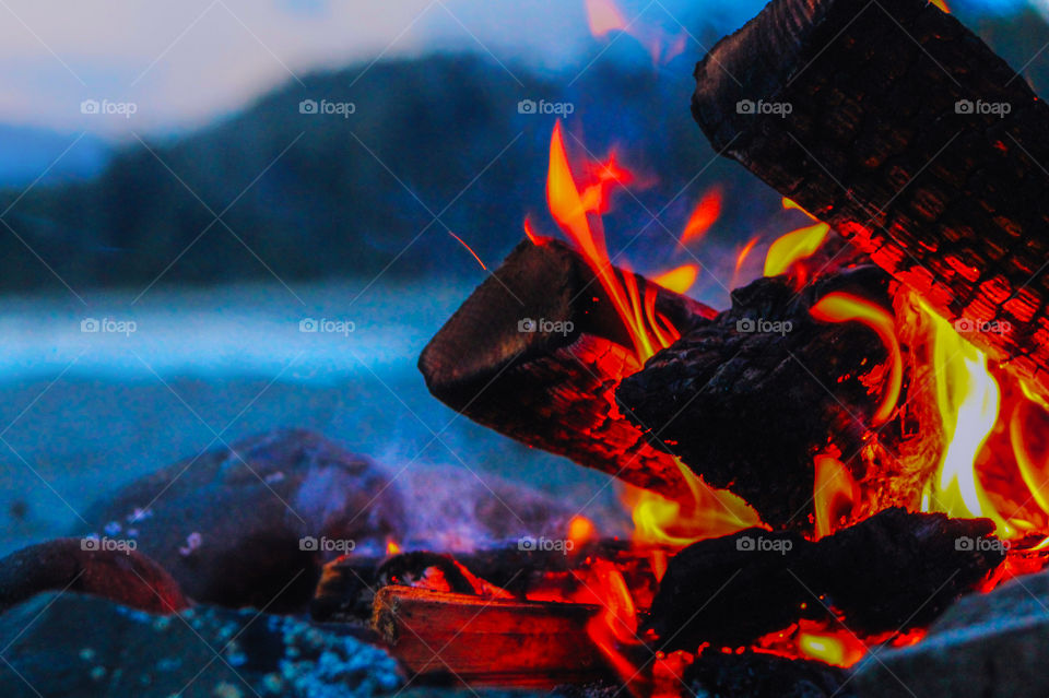 Many of my photos are taken in the magic hours between day & night. As the sun was setting we lit a beach fire to keep us warm while we watched; the sky fill with a myriad of coloured light, & the fire flames & smoke dance & sway in the soft breeze. 