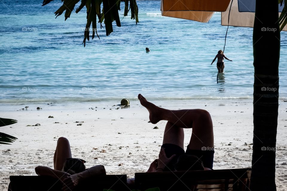 Happy hour relaxing together on the beautiful beach 