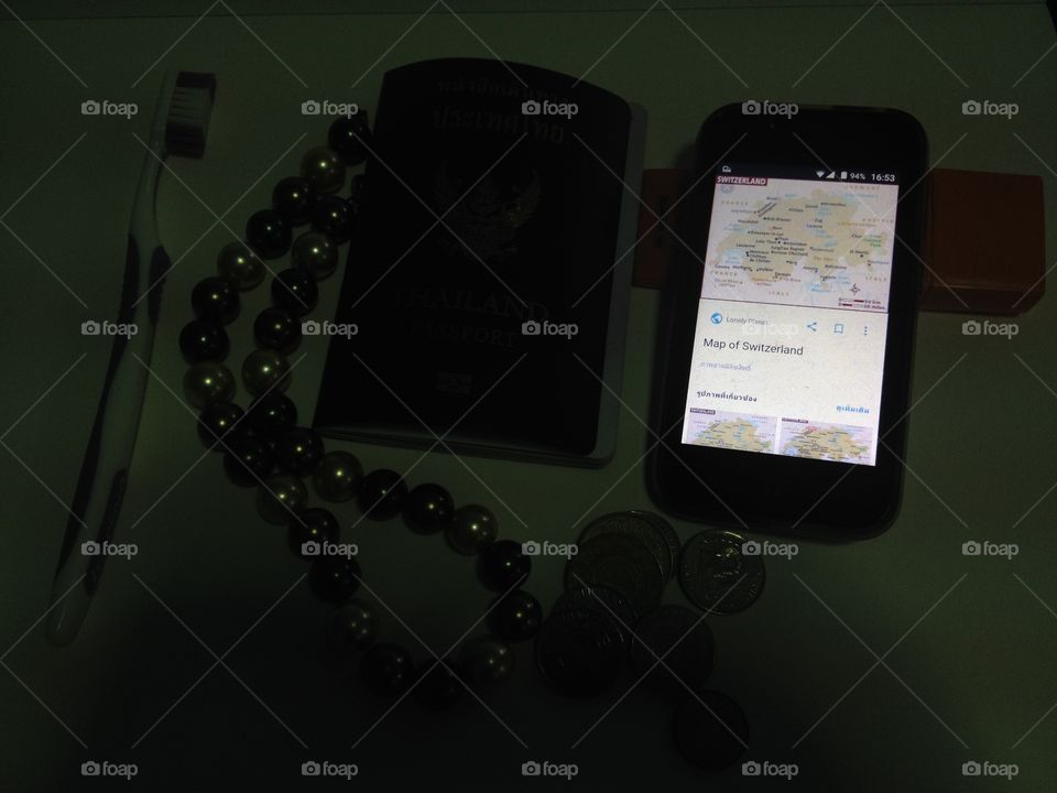 Mobile map glowing on black blur background.