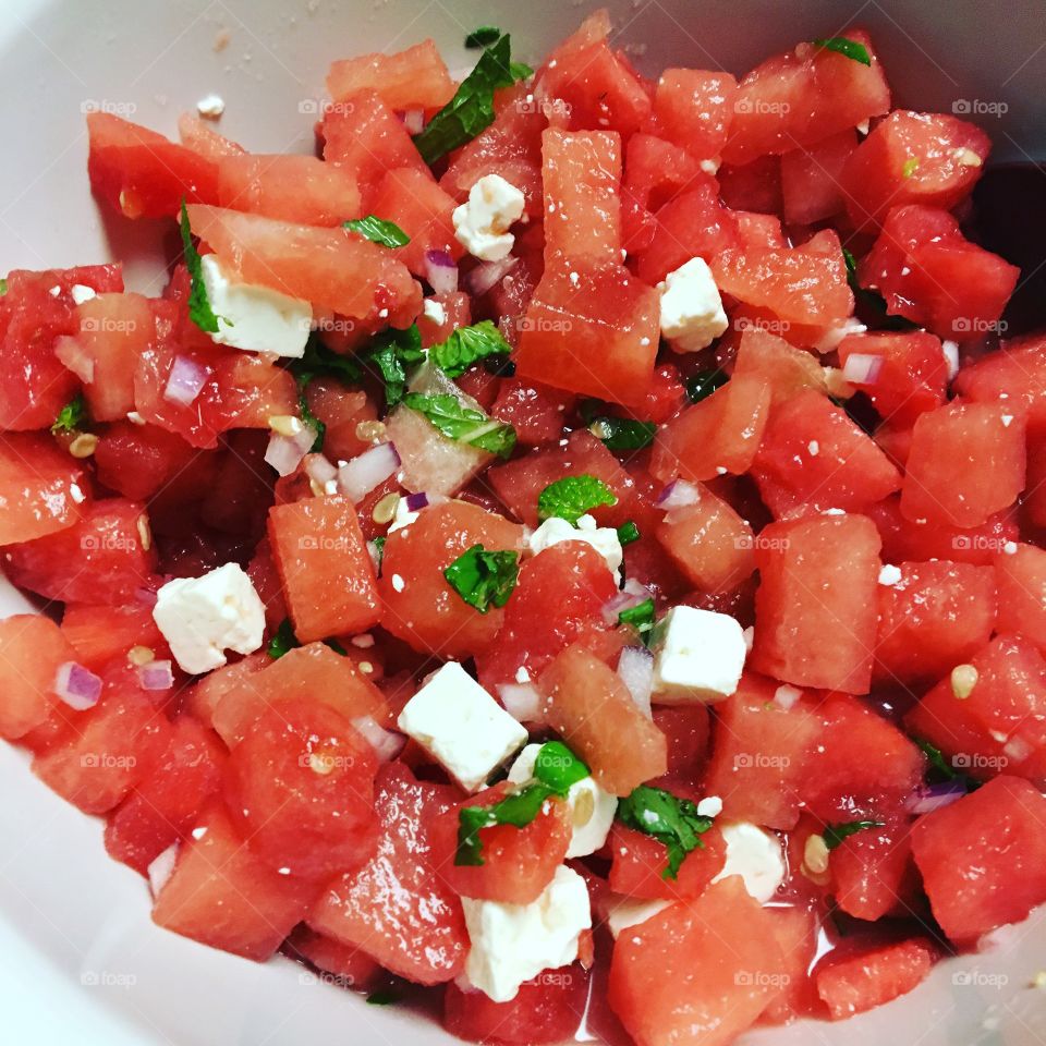 Watermelon Salad - With peta cheese, mint leaves, lemon , olive oil, red onion with a dash of salt and pepper. 